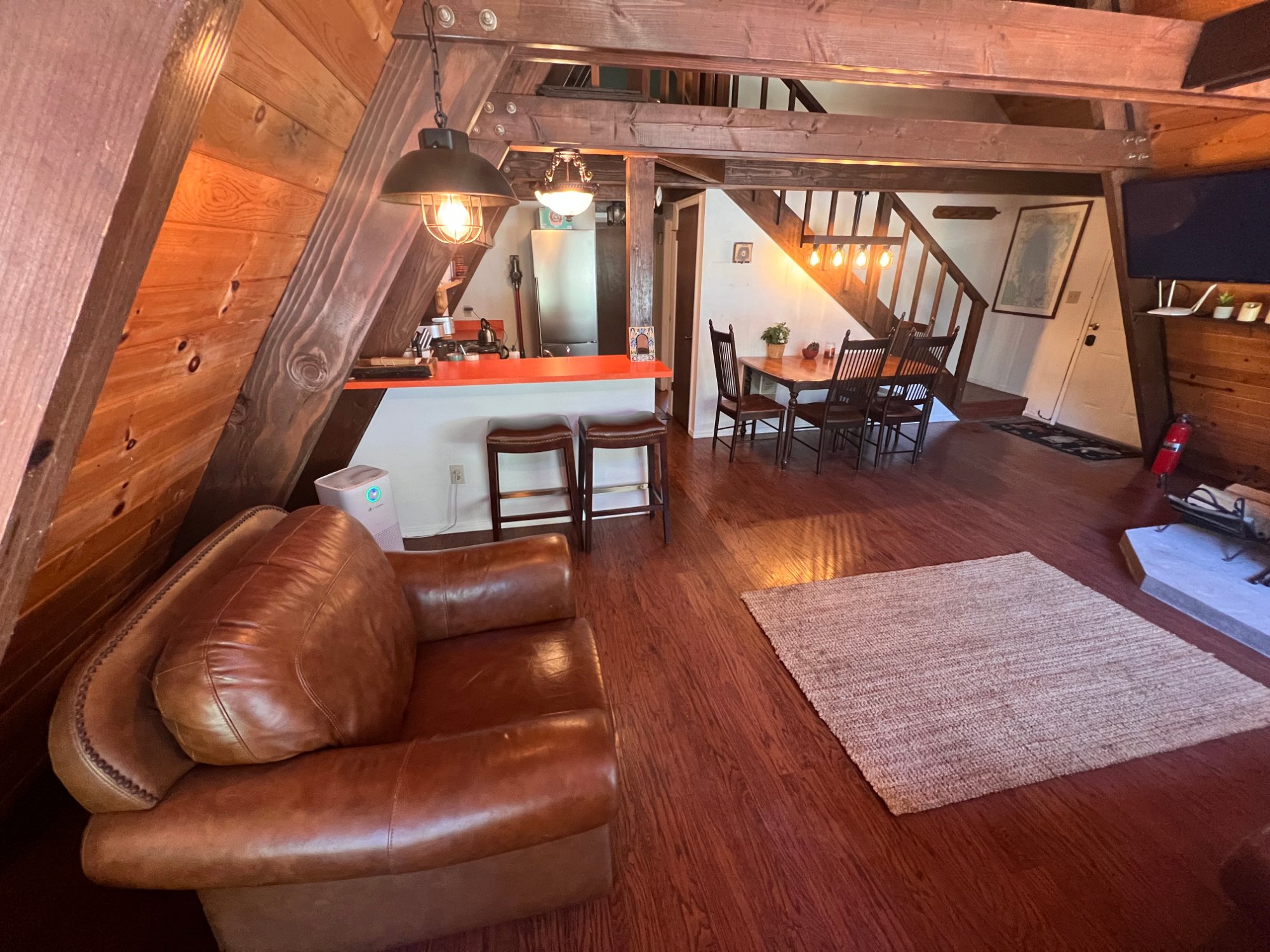 Main bedroom with lantern sconces and king bed