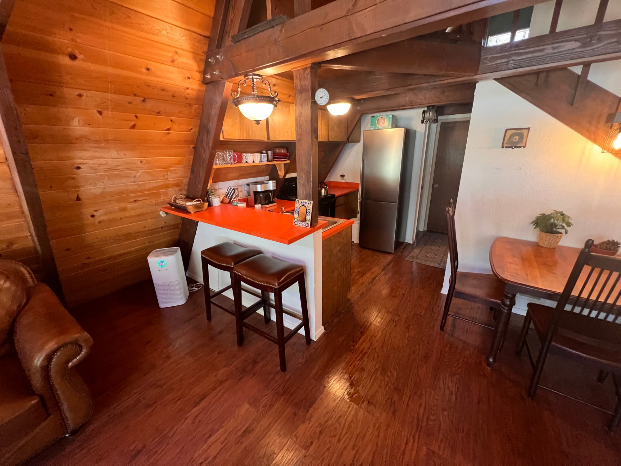 Kitchen with breakfast bar and pendant lights